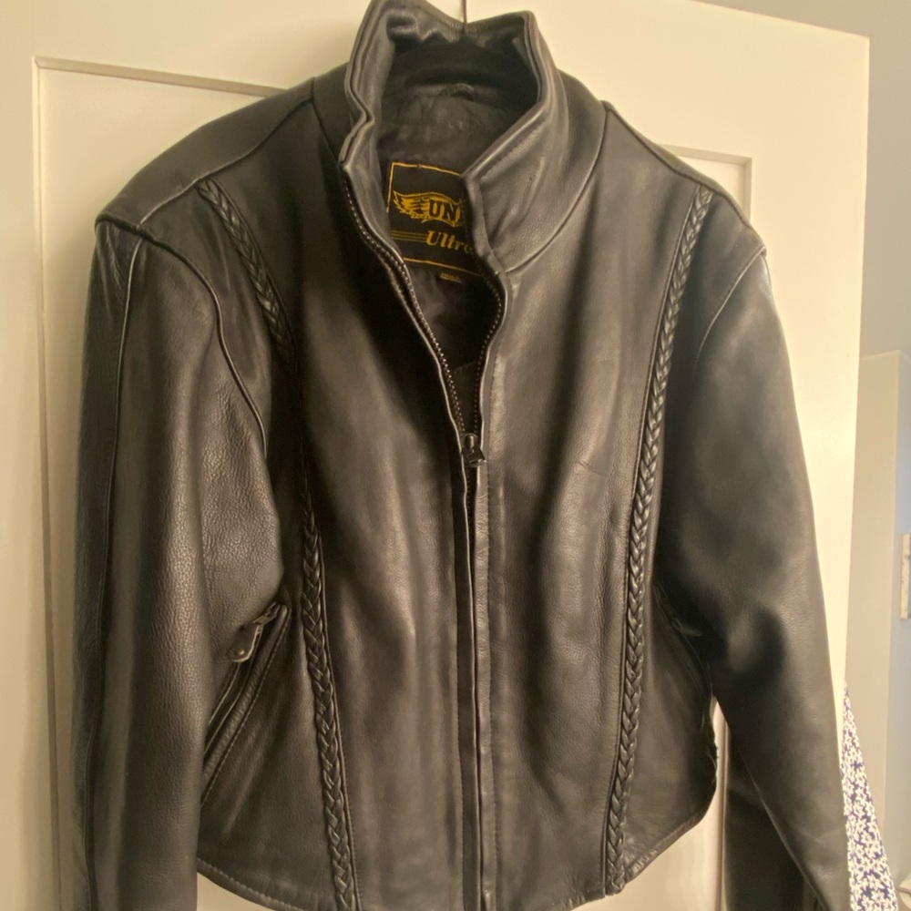 leather jacket. zipper front, sleeves. two front zip pockets